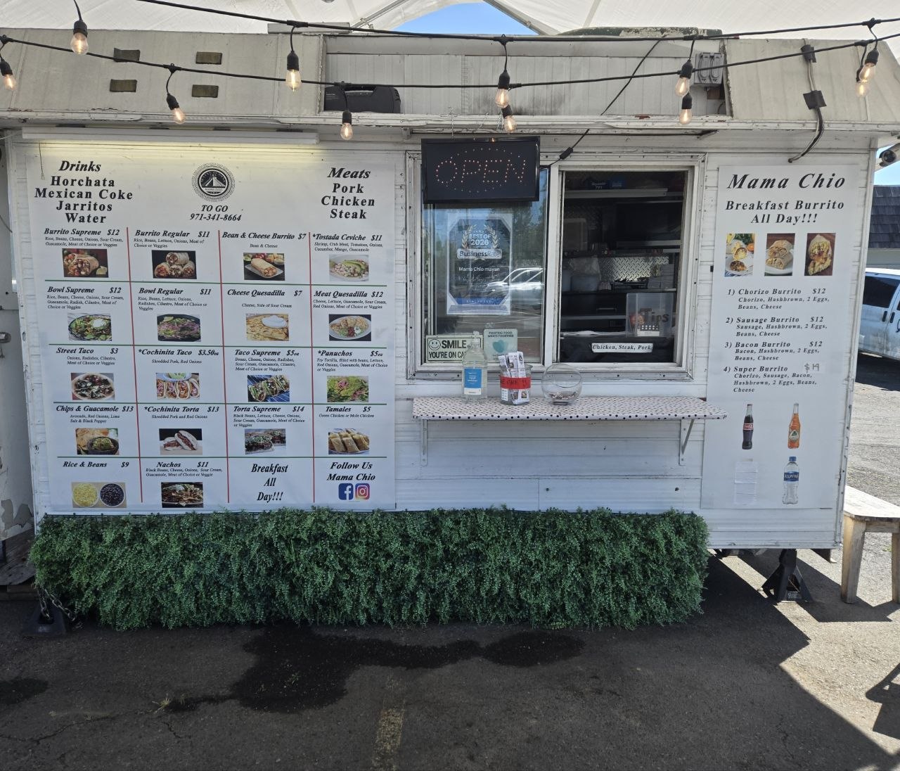 The food cart displays its full menu of Mexican dishes and drinks.